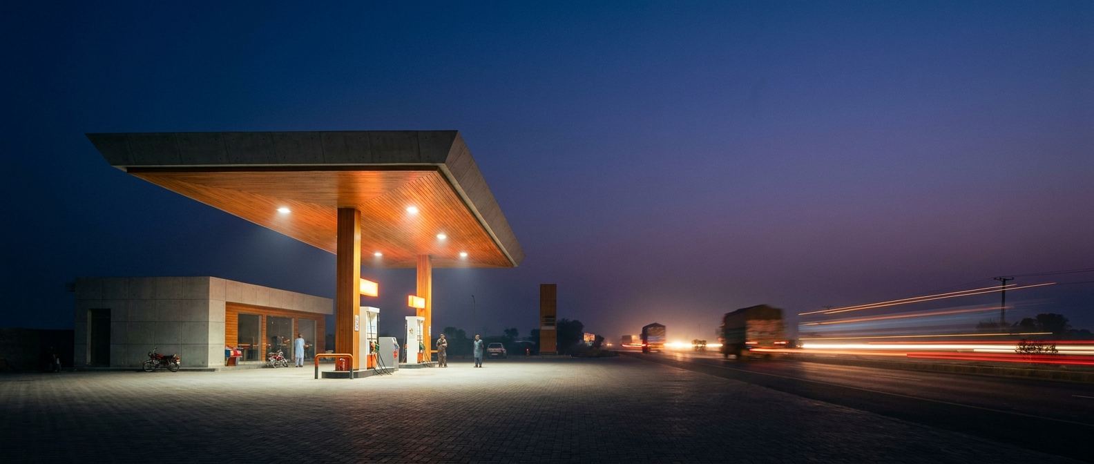 Modern FPL fuel station beside a highway at dusk